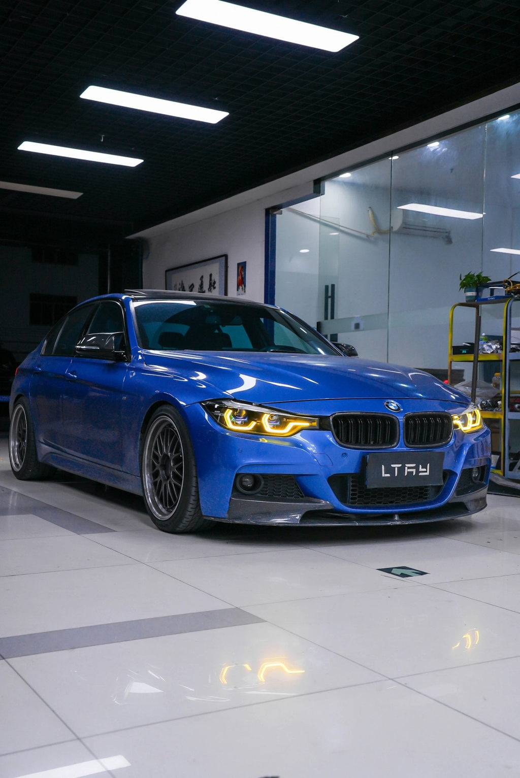 Blue BMW car in a showroom - bmw mods, styling, detailing