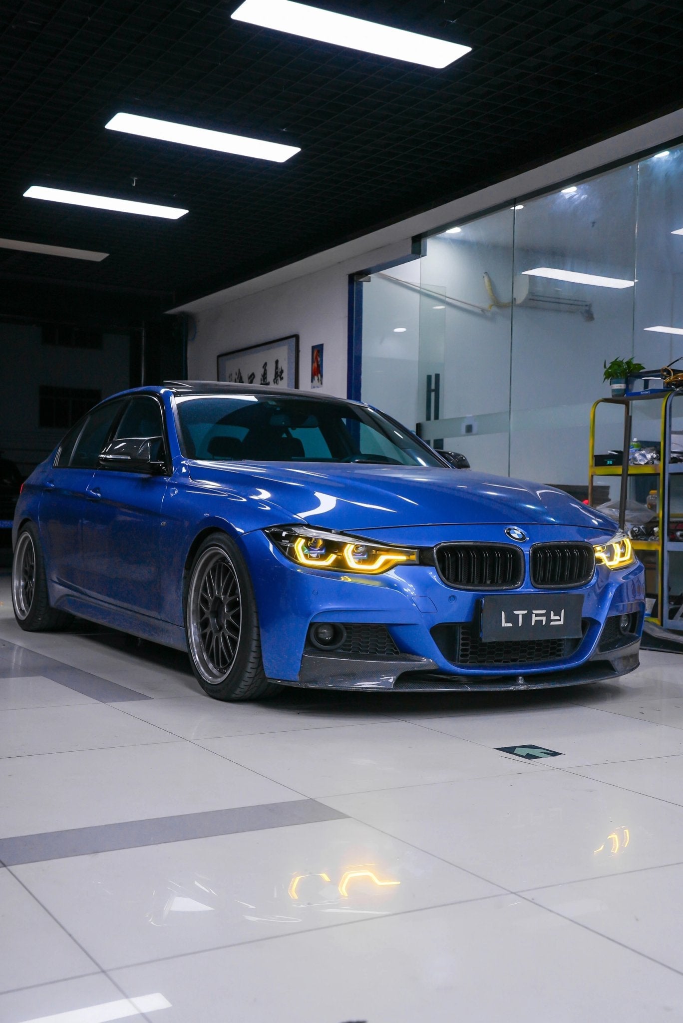 Blue BMW car in a showroom - bmw mods, styling, detailing